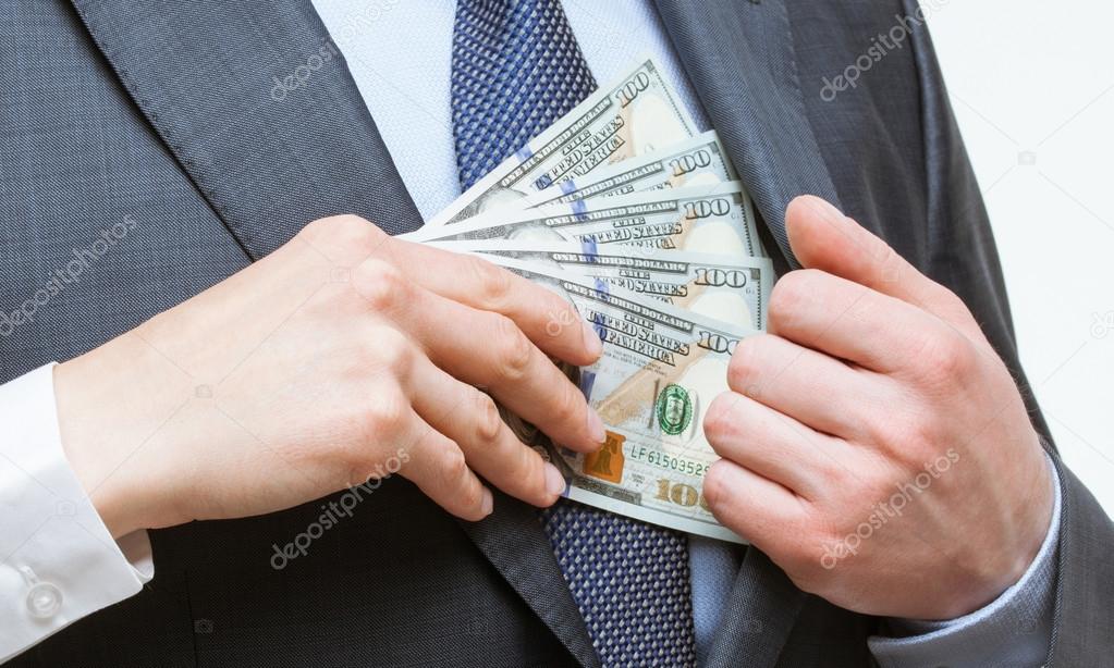Giving a bribe into a pocket