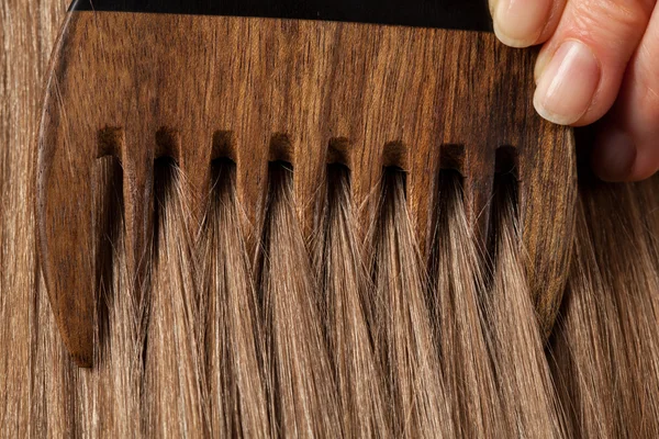 Hand combing beautiful long hair — Stock Photo, Image