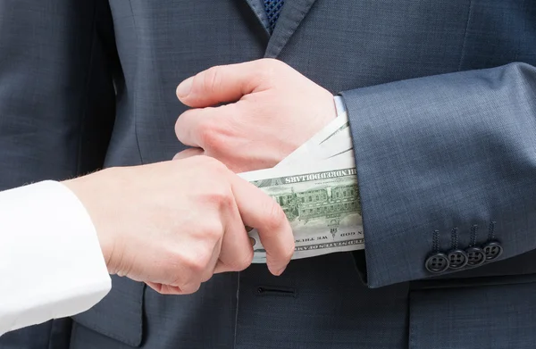 Giving a bribe into a sleeve — Stock Photo, Image