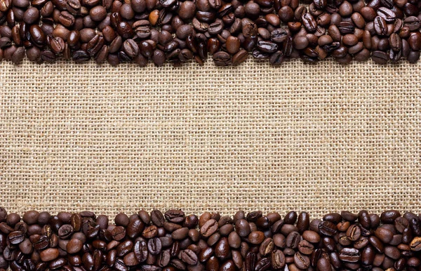 Border frame of coffee beans on the old burlap