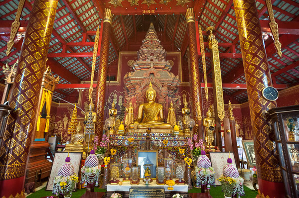 Ornate interior of Wat Chiang Man, the oldest temple in Chiang Mai, Thailand