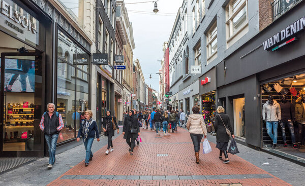 AMSTERDAM, NETHERLANDS - SEPTEMBER 24, 2017: Amsterdam Nieuwendijk Street. The famous street is the main shopping mile of Amsterdam. Netherlands.