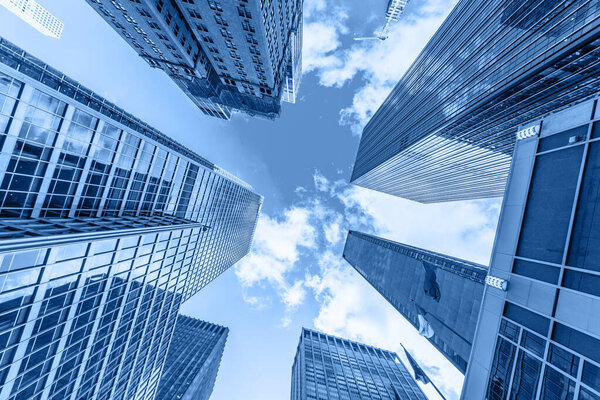 Skyscrapers in a finance district at Manhattan. New York, USA. Perspective view of modern skyscrapers glass wall.