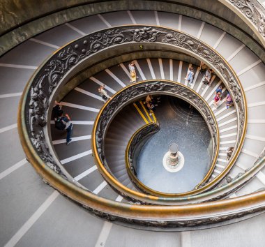 VATICAN CITY, ITALY - JULY 1, 2019: Bramante Staircase in Vatican Museum in the Vatican City. Rome, Italy. The double helix spiral staircase is is the famous travel destination. clipart