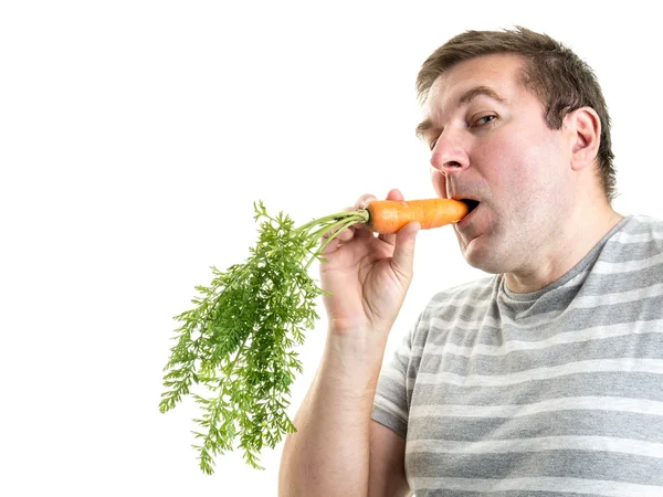 Muž s mrkví — Stock fotografie