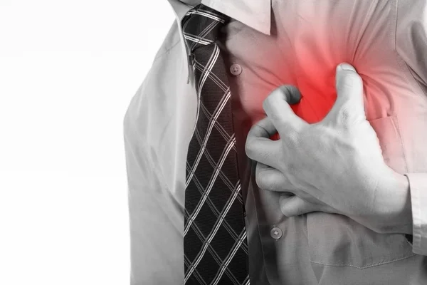 Businessman using hands for press his chest — Stock Photo, Image