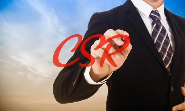 Businessman write csr ,corporate social responsibility concept — Stock Photo, Image