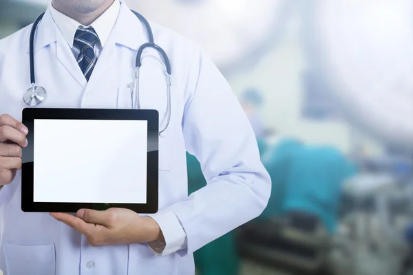 Doctor holding tablet for show blank screen in hospital.