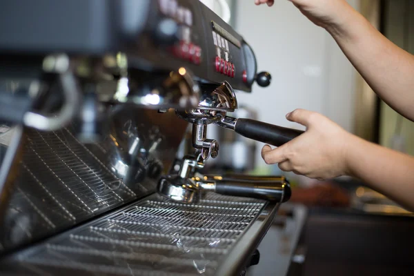 Coffee machine make beverage hot drink to customer.
