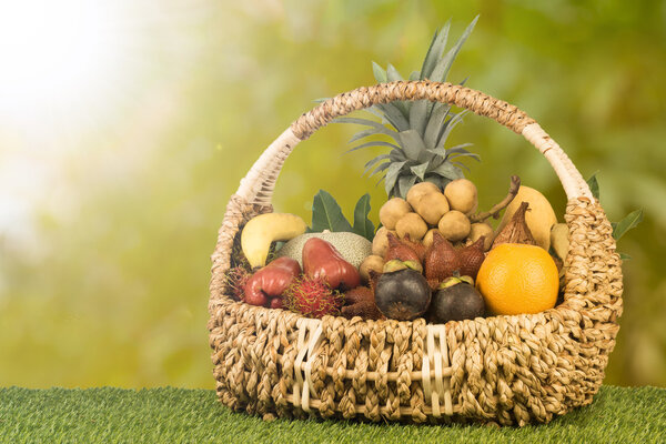 Tropical fruits inside basket that good for healthy with oraganic food.