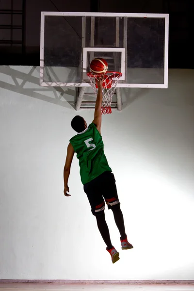 Basketball player jump for shooting ball — Stock Photo, Image