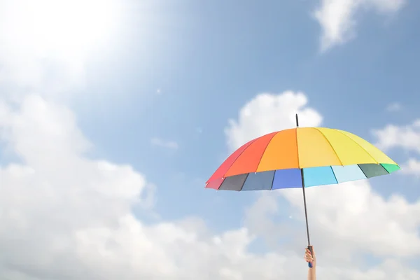 Holding colorful umbrella — Stock Photo, Image