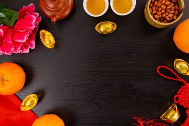 Flat lay Chinese new year mandarin orange and tea water with top view Copy space  for celebrate china festival.Chinese characters ZHAO CAI JIN BAO in the article refer to lucky fortune ,wealth, rich