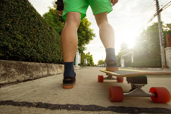 Surfskate board new activity in new normal for young people play in village street.Outdoor extreme sport for exercise.