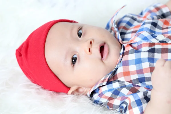 Asain baby hiding under white cloth and looking something — Stock Photo, Image