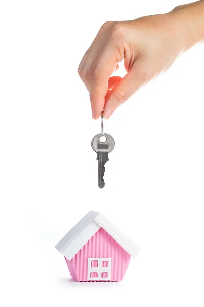 Concepto inmobiliario con llave de mano . — Foto de Stock