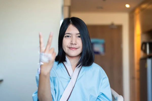 Patient Woman Showing Fingers Hospital Health Care Insurance Concept — стоковое фото