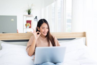 Happy woman using video conference call to people,Work from home,Work at home,New normal concept clipart