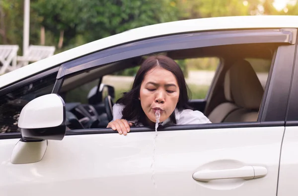 Woman puke or vomiting on window in car,Car Sick and motion sickness