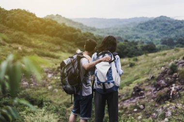 Couple lover standing and looking beautiful view feeling happy and smiling together,Enjoying camping in nature