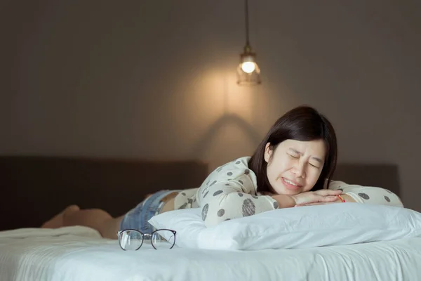 Asian woman sleeping and grinding teeth at bedroom,Female tiredness and stress
