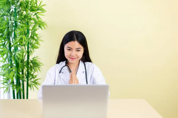 Asian woman doctor video call talking online to patient,Consult and therapy concept