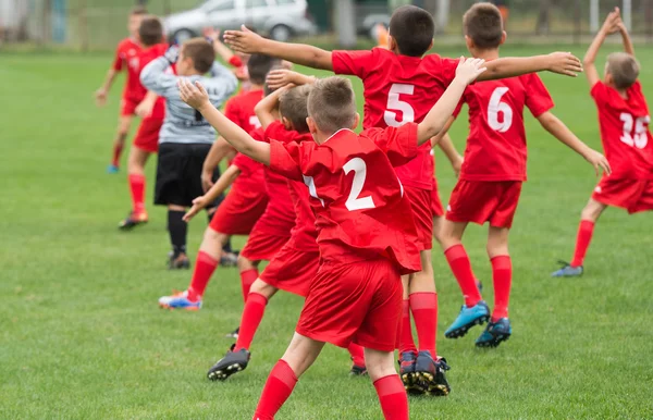 Boys kicking ball — Stock Photo, Image