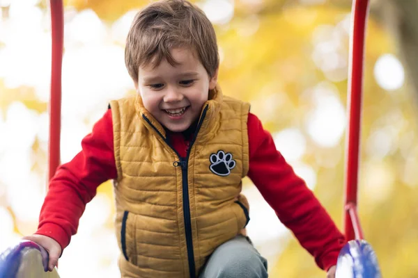 Happy Smiling Child Boy Climbing Frame Slide Outdoors Playground — стоковое фото