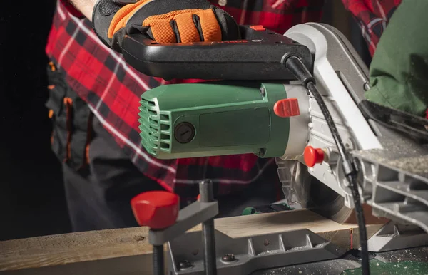 Closeup Young Man Sawing Lumber Sliding Compound Miter Saw Indoors — 스톡 사진