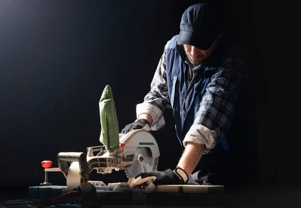 Closeup Young Man Sawing Lumber Sliding Compound Miter Saw Indoors — Stok fotoğraf