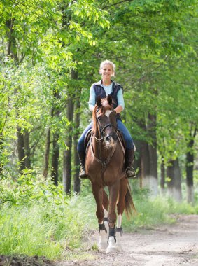 Girl on horseback riding clipart