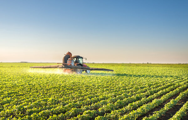 Tractor spraying