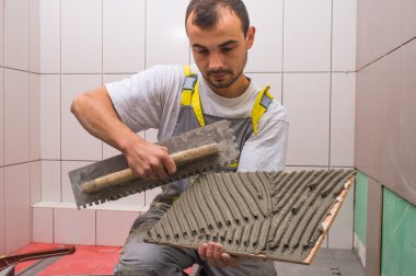 Install ceramic tiles clipart