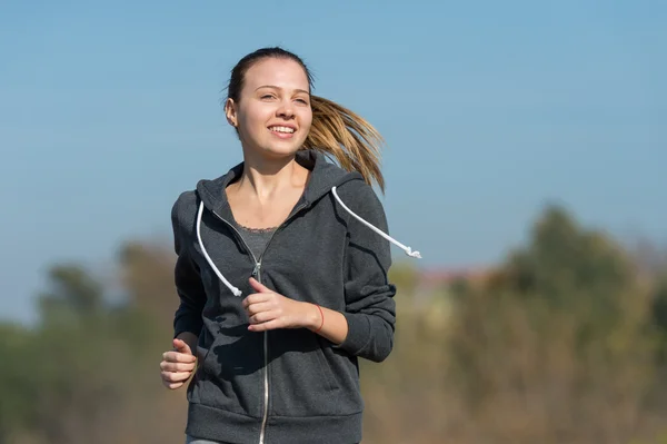 Pretty young girl  jogging — Stock Photo, Image