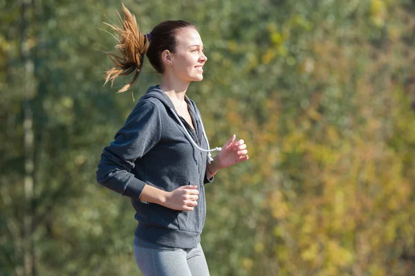Pretty young girl  jogging — Stock Photo, Image