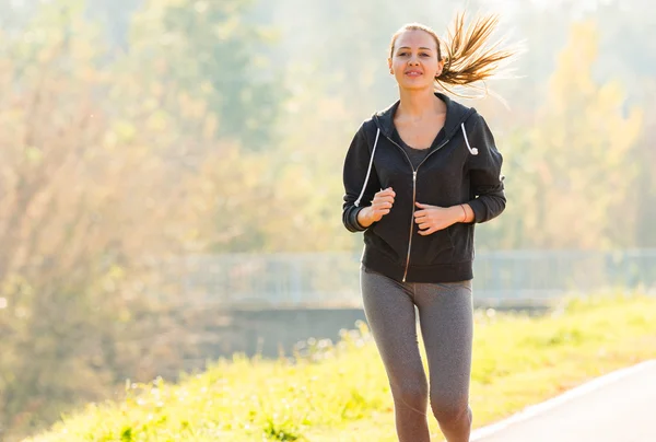 Pretty young girl  jogging — Stock Photo, Image