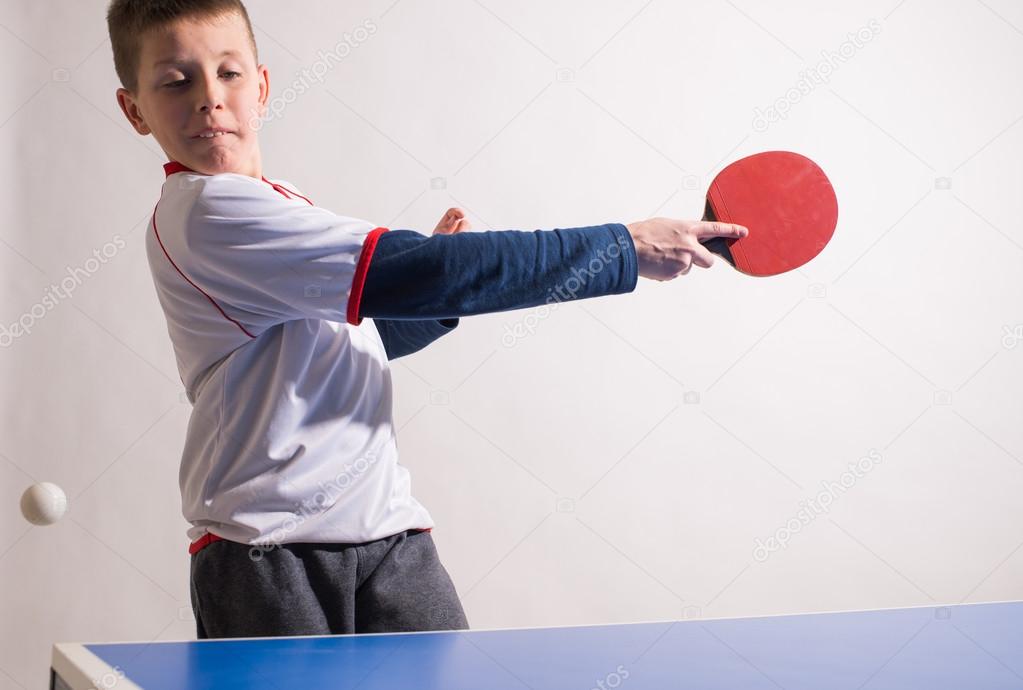 boy playing table tennis