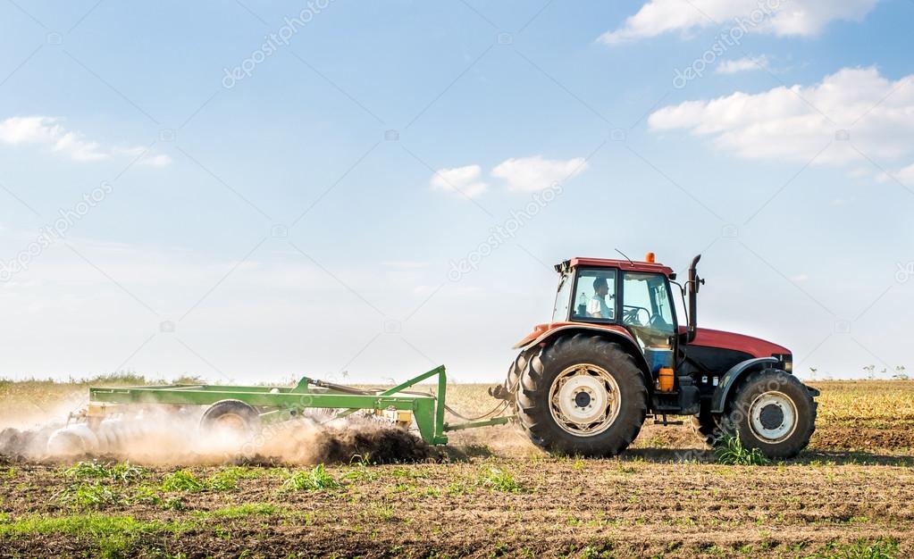 Tractor preparing land 