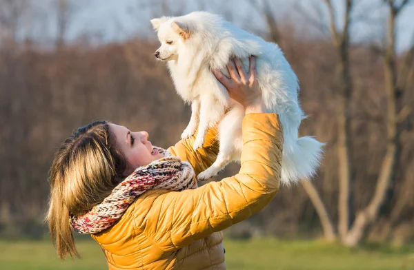 Happy girl with her little dog — Stock Photo, Image