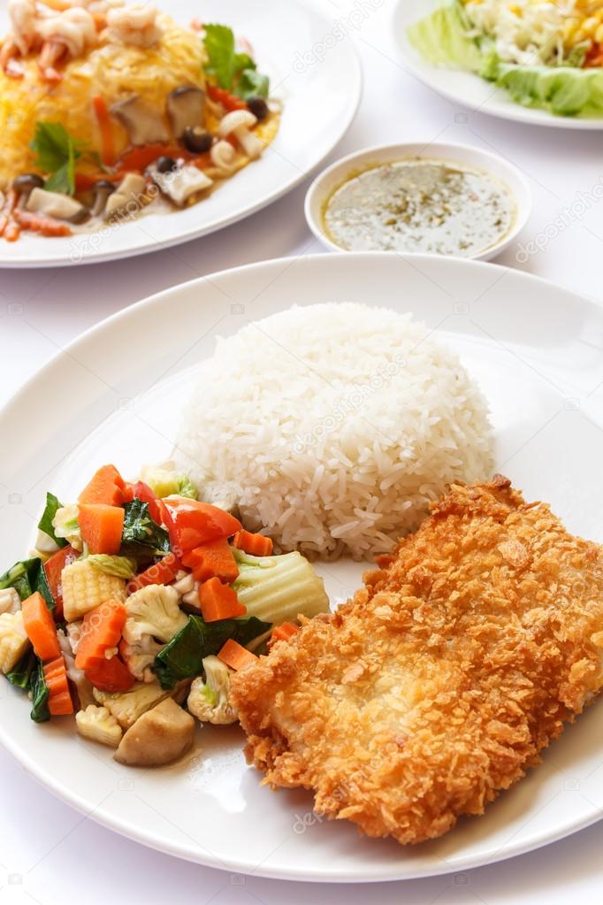 Thai Food, rice, mix vegetables and fried fish.