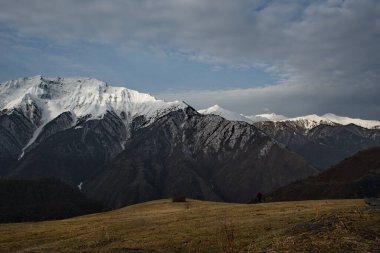Russia. North-Eastern Caucasus, Republic of Dagestan. Snow peaks of mountain peaks near the village of Tlarata.