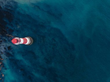 Aerial Drone Landscape photo of a Beachy Head Lighthouse and chalk cliffs at colorful sunrise  with low tide in England, near Eastbourne