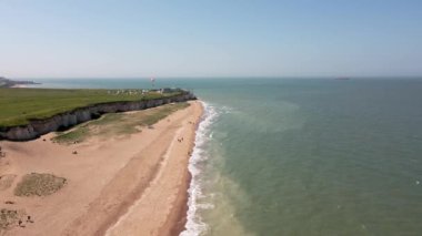 Botany Bay sahilindeki deniz kenarında bir paraglider.