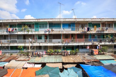 The old apartment at Chung Cu Ngo Gia Tu with outdoor market in the morning.