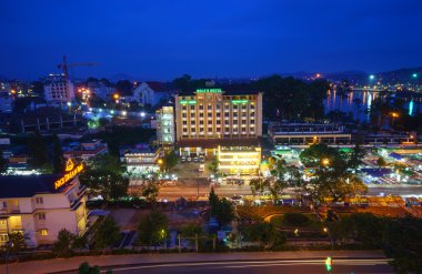 Dalat city at night from high above with hotels, da lat market and road.