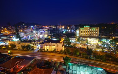 Dalat city at night from high above with hotels, da lat market and road.