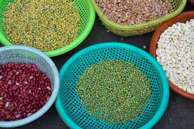 Various colorful beans at plastic basket at Ho Chi Minh City local market
