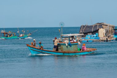people and boats moving to fishing from the fishery harbor Nam Du Island, Kien Giang, Vietnam