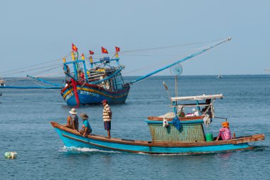 people and boats moving to fishing from the fishery harbor Nam Du Island, Kien Giang, Vietnam