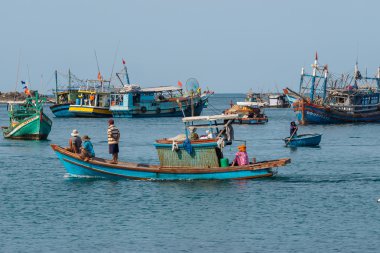 people and boats moving to fishing from the fishery harbor Nam Du Island, Kien Giang, Vietnam
